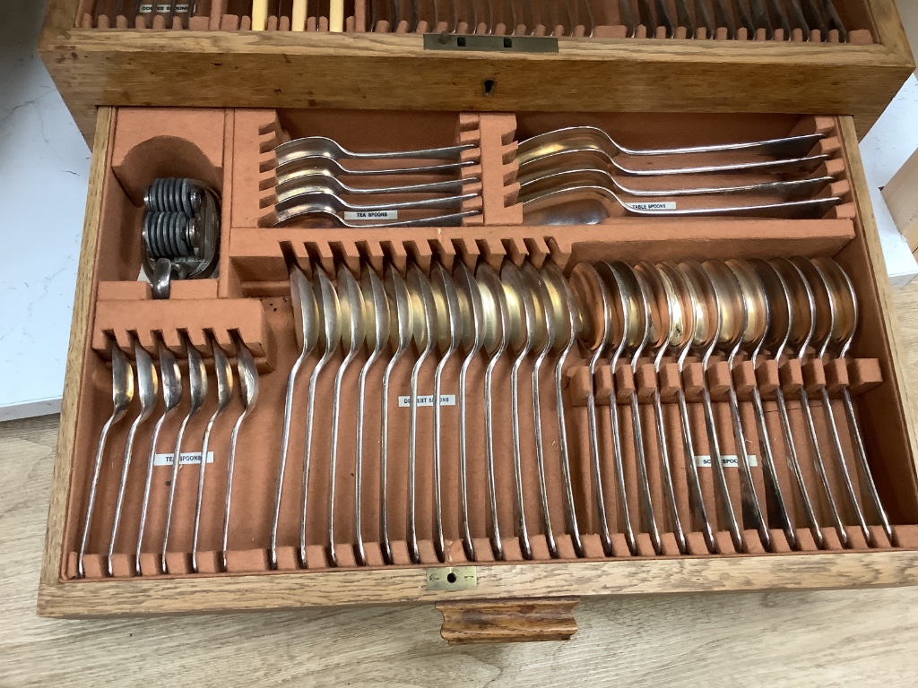 An oak cased plated part canteen of cutlery